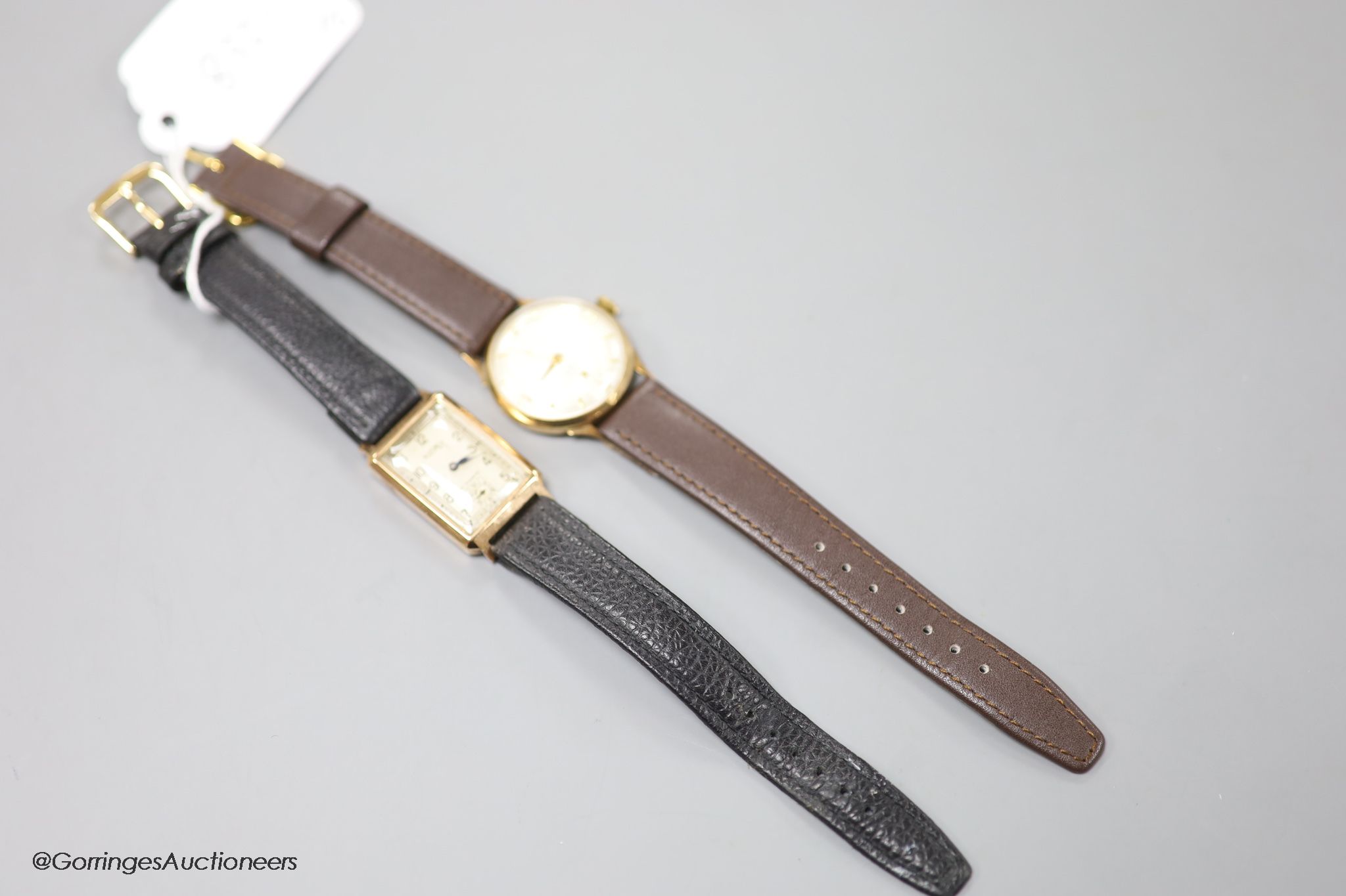 A gentleman's 1930's 9ct gold Rotary rectangular manual wind wrist watch (lacking winding crown) on later leather strap and a later 9ct gold Rodania manual wind wrist watch